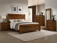 A wooden bedroom set with dresser and mirror showcasing fine craftsmanship